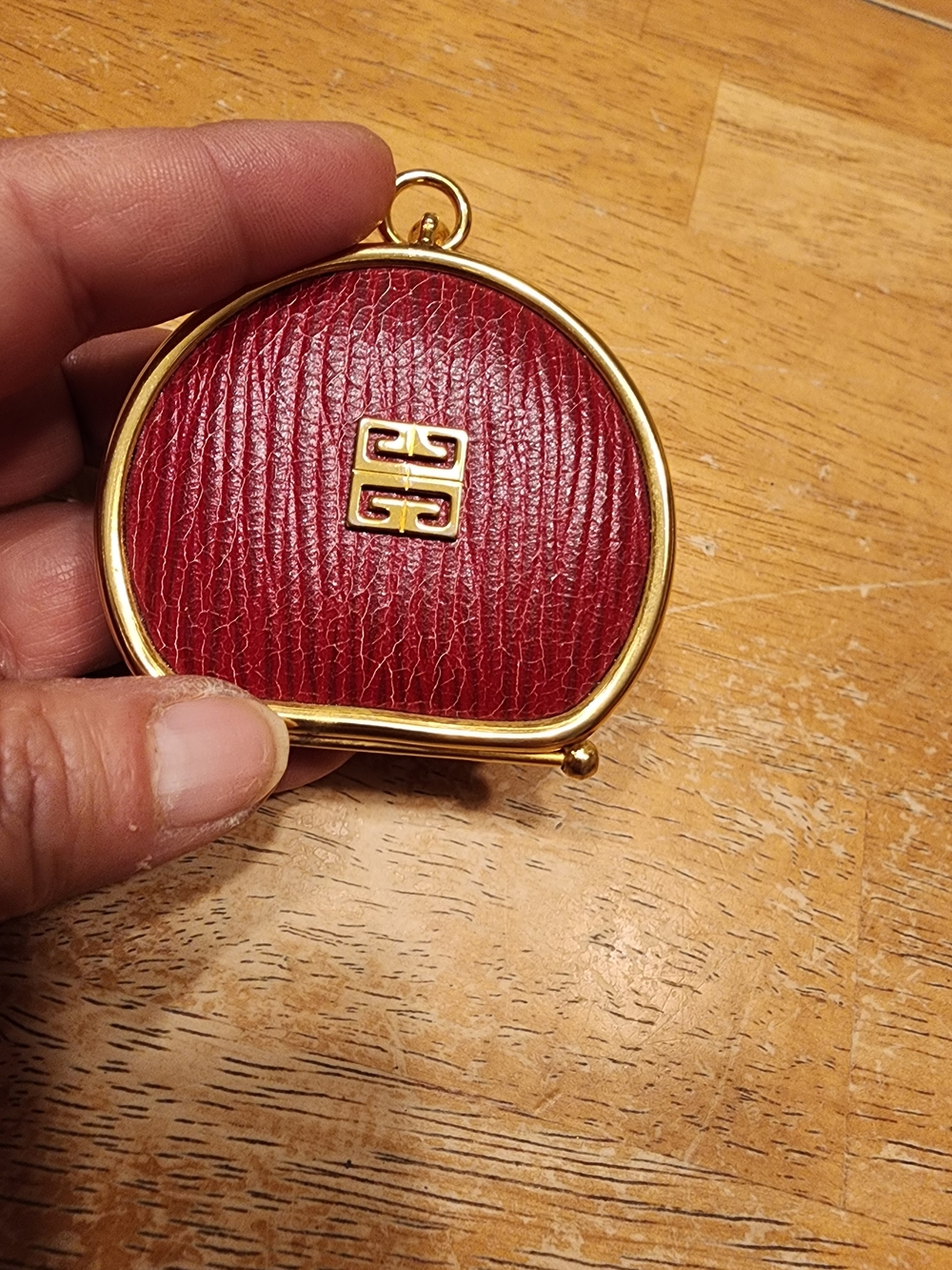 vintage Givenchy coin purse crafted from red textured leather gold-tone hardware